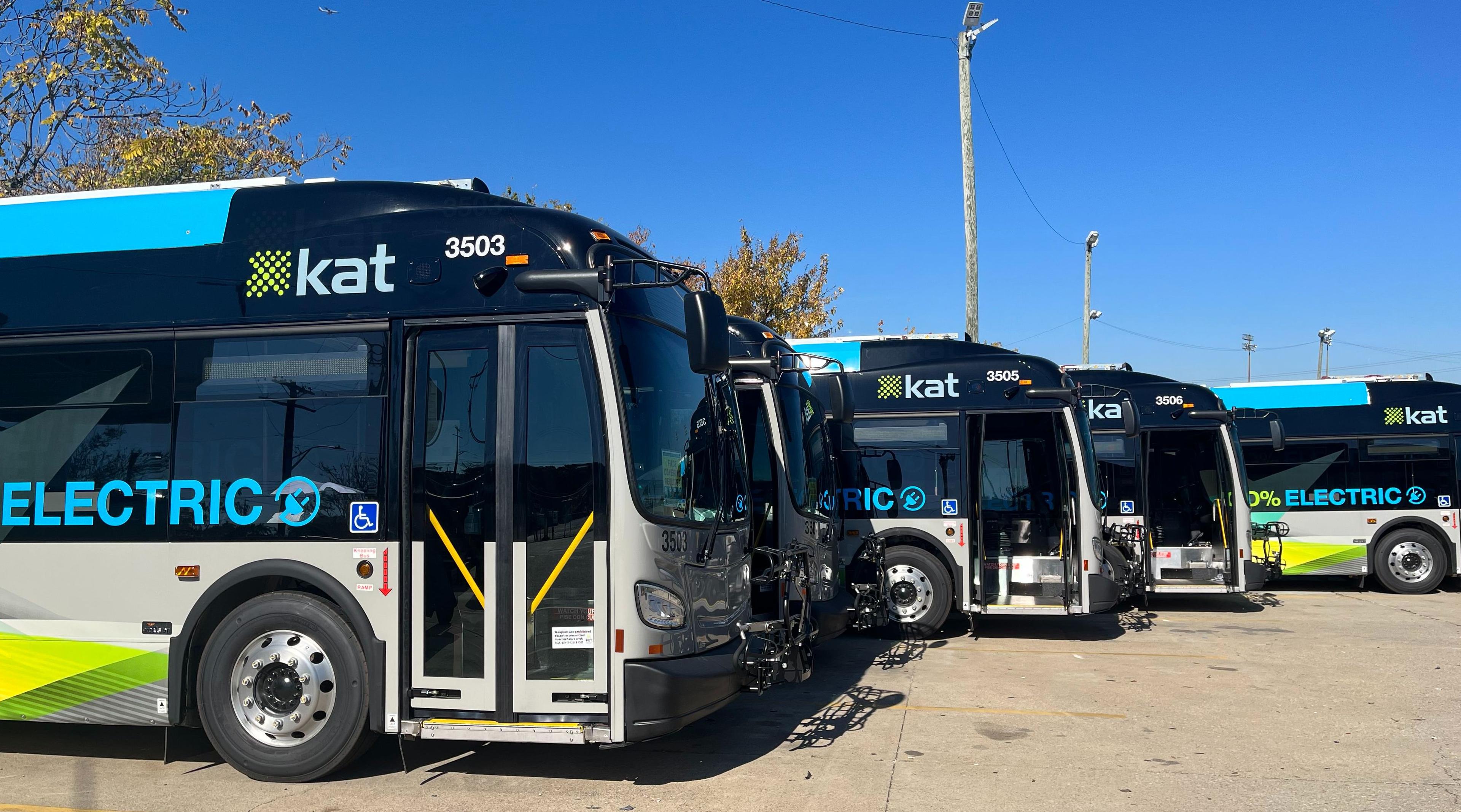 a line of electric buses at Knoxviller Area Transit depot