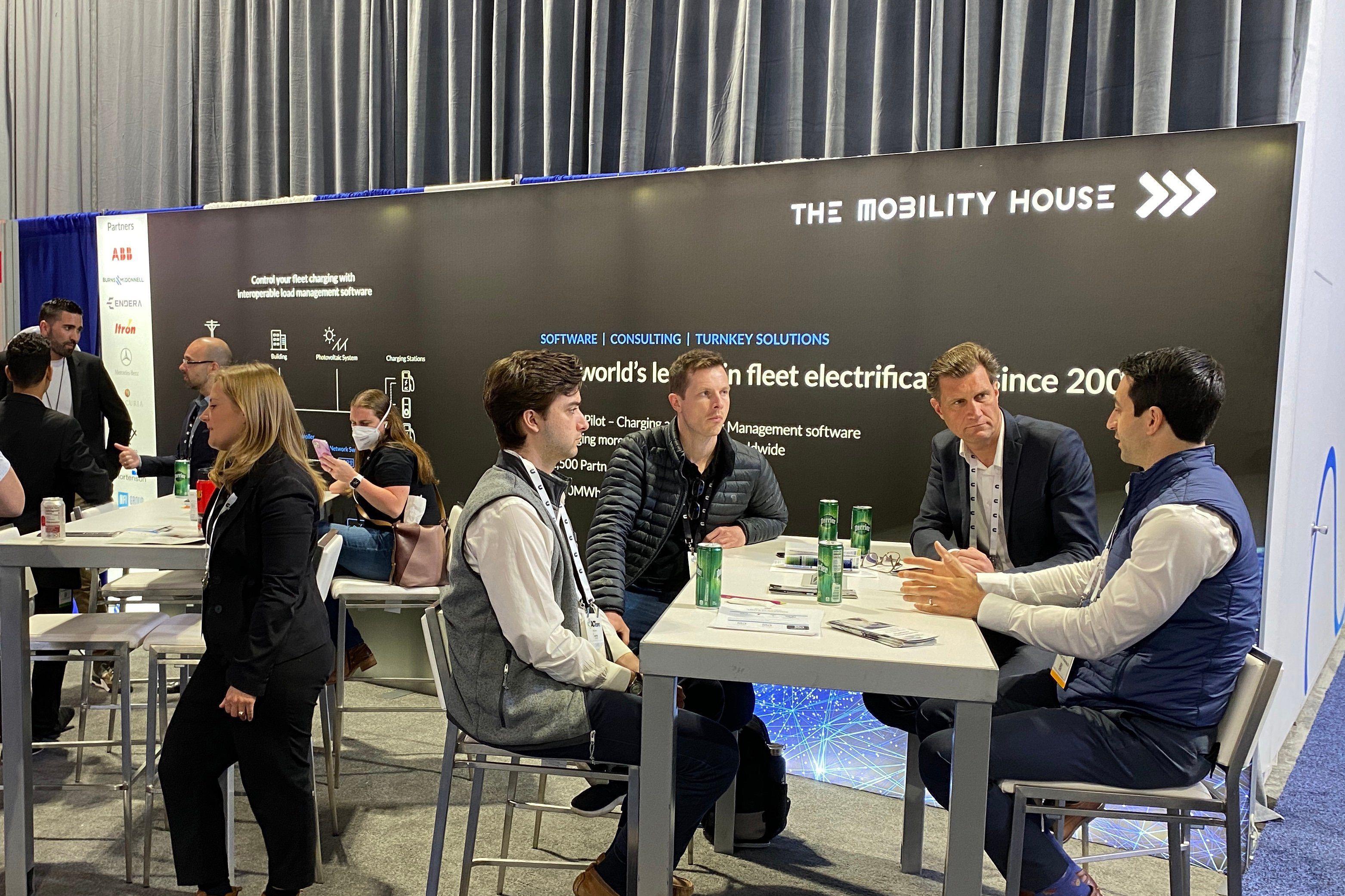 People engaging at the The Mobility House booth at ACT Expo 2022