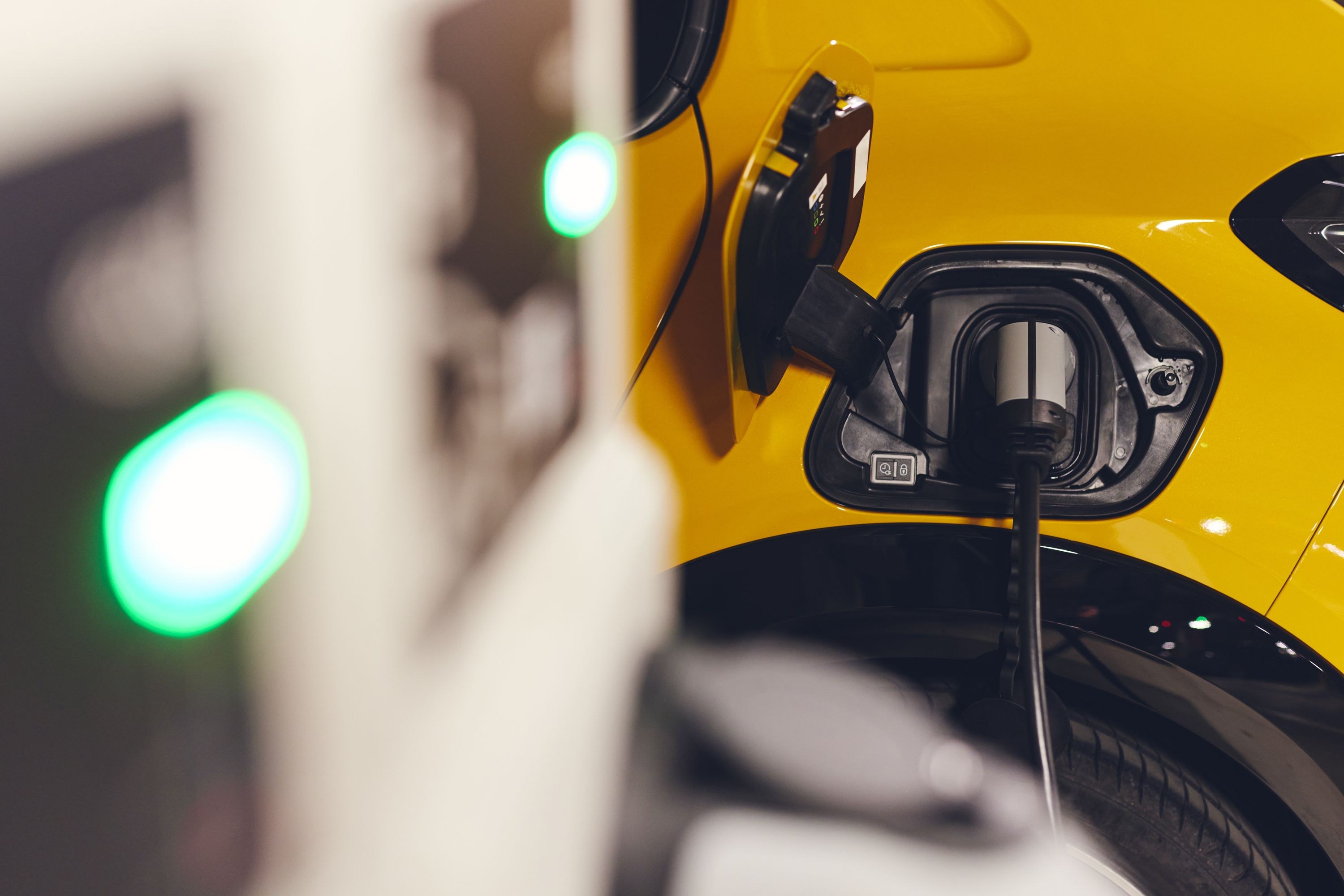 electric car charing plugged in