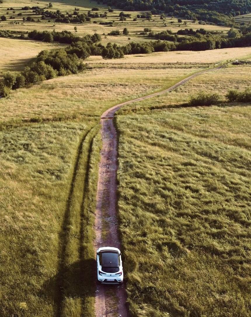 A car driving through a landscape